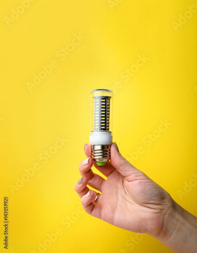 Hand holding LED bulb lamp