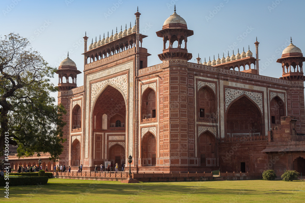 Taj Mahal east gate - A beautifully crafted red sandstone structure bearing the heritage of Mughal architecture in India.