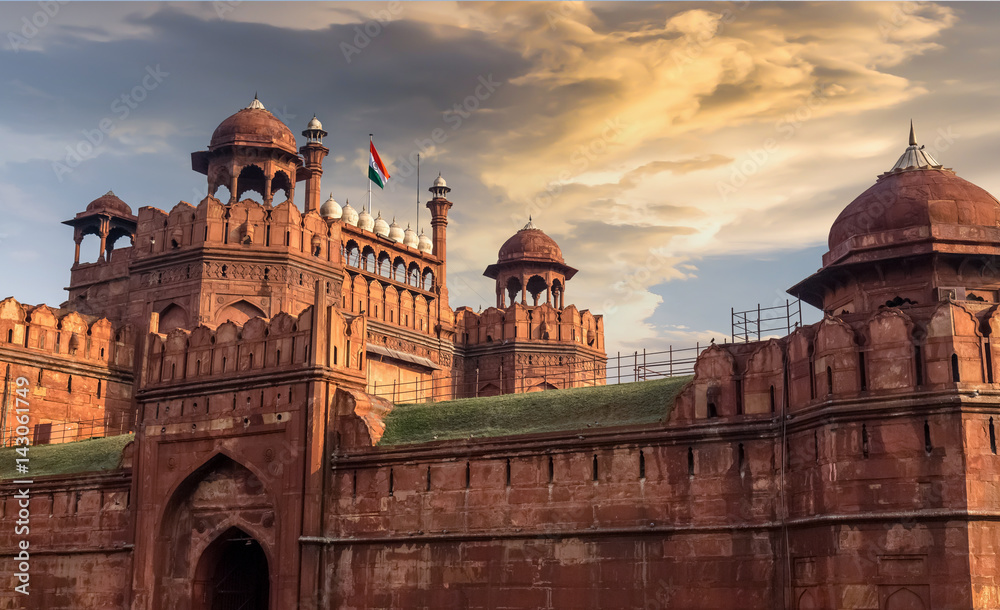 Red Fort Delhi at sunset with moody sky - A UNESCO World heritage site.