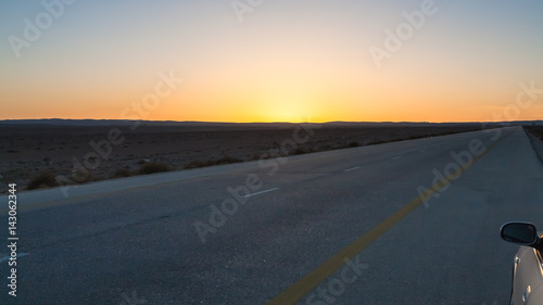 sunset over Desert Highway (Road 15) in Jordan