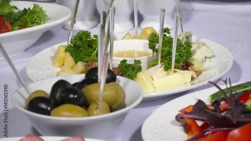 Closep of olives in the plate on the table photo