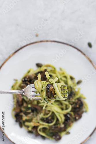 Close-up of Linguine, Pesto and Mushrooms Twisted on Fork 