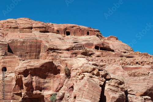 Sito archeologico di Petra, 02/10/2013: le costruzioni e le diverse colori, forme e sfumature delle rocce rosse nel canyon della valle giordana  photo