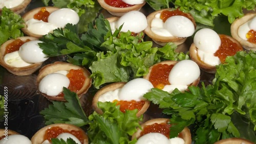 Tasty toasts with caviar on the plate in the restaurant photo