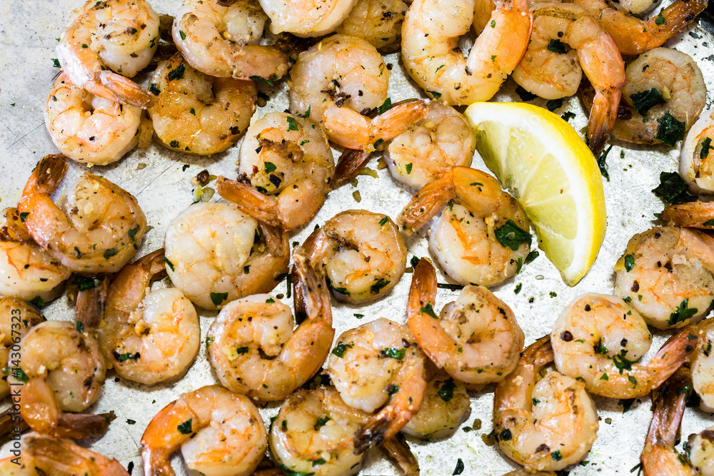 Shrimp On Metal Pan With Lemon Wedge From Above Shrimp On Metal Pan With Lemon Wedge From Above