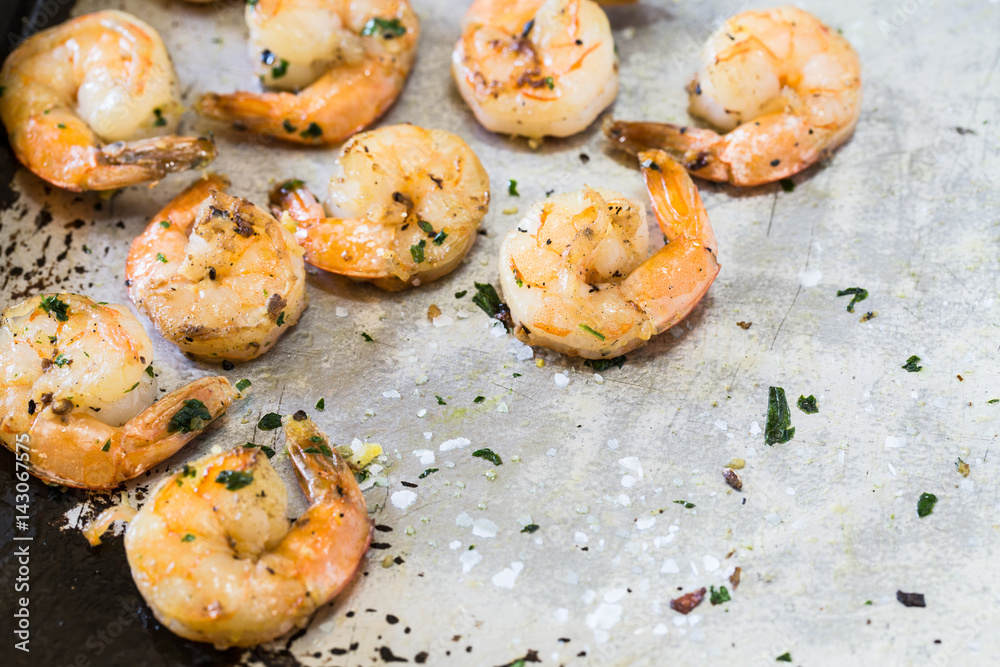 Grilled Shrimp Dinner On Metal Pan With Salt and Parsley Grilled Shrimp Dinner On Metal Pan With Salt and Parsley