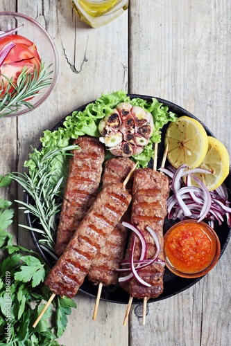 Kebab .Traditional meat kebab of minced beef or lamb with vegetables and herbs .Selective focus