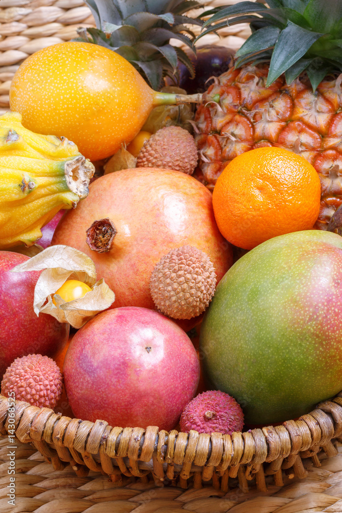 Lychee, pomegranate, mango. Exotic fruits in a basket. Lychee, pomegranate, mango. Exotic fruits in a basket.