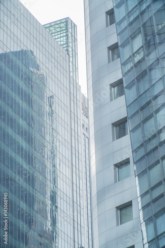 Skyscrapers with glass facade. Modern buildings in business district. Concepts of economics, financial, future