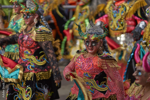 Masked Diablada dancers in ornate costumes parade through the mining city of Oruro on the Altiplano of Bolivia during the annual carnival.