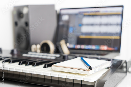 фотографія Blank notebook on music studio for song writing