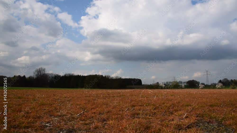 red field with huge clouds and mysterious feeling red field with huge clouds and mysterious feeling