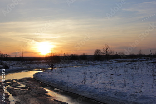 winter road is in a rural location sunset © Evgeniya