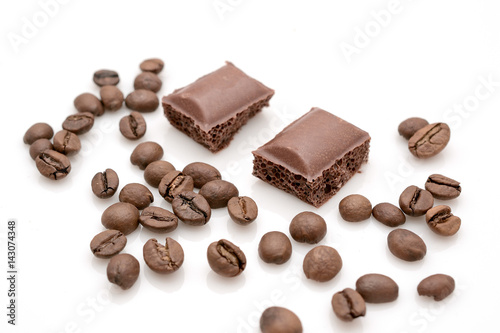 Chocolate and coffee beans isolated on white background