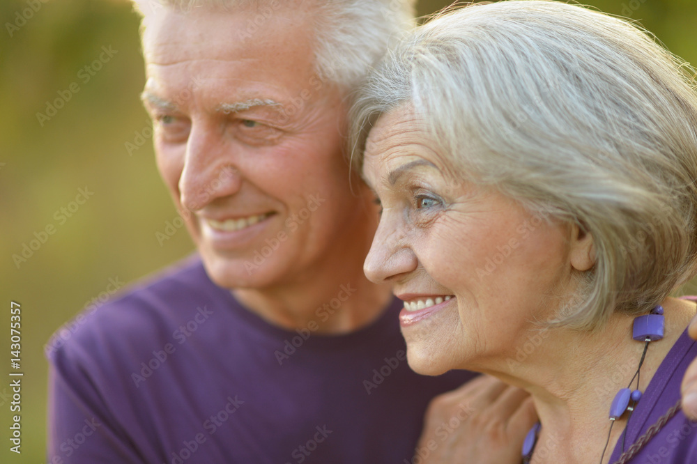 Happy elderly couple embracing