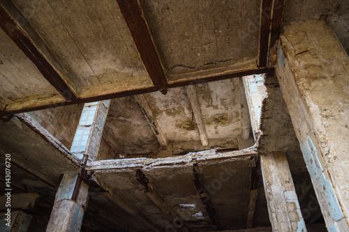 Abandoned concrete construction with destructed ceiling