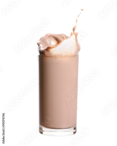 Splash of chocolate milk from the glass on isolated white  background.