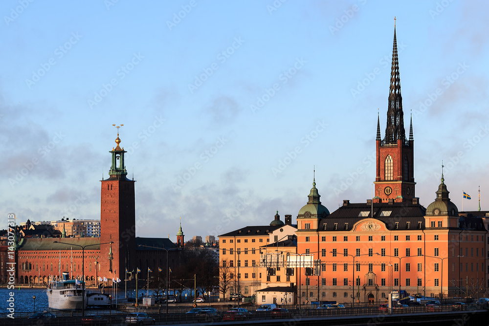 Cityscape view of Stockholm, Sweden with City hall to left and The Riddarholmen Church to the right