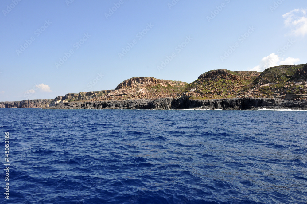 Blue sea and characteristic caves of Cala Luna Golfo di Orosei Sardegna or Sardinia Italy