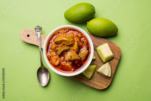 Homemade Mango Pickle or aam ka achar or achaar in white bowl, selective focus