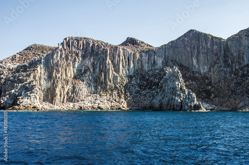 Blue sea and characteristic caves of Cala Luna Golfo di Orosei Sardegna or Sardinia Italy photo