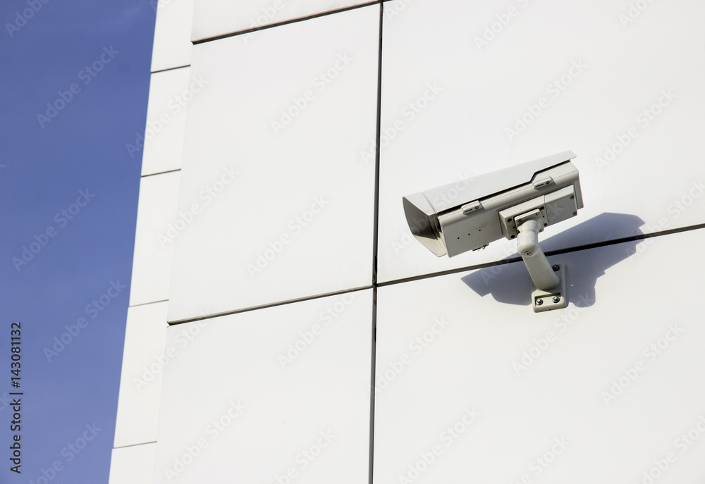 CCTV camera on wall of office building