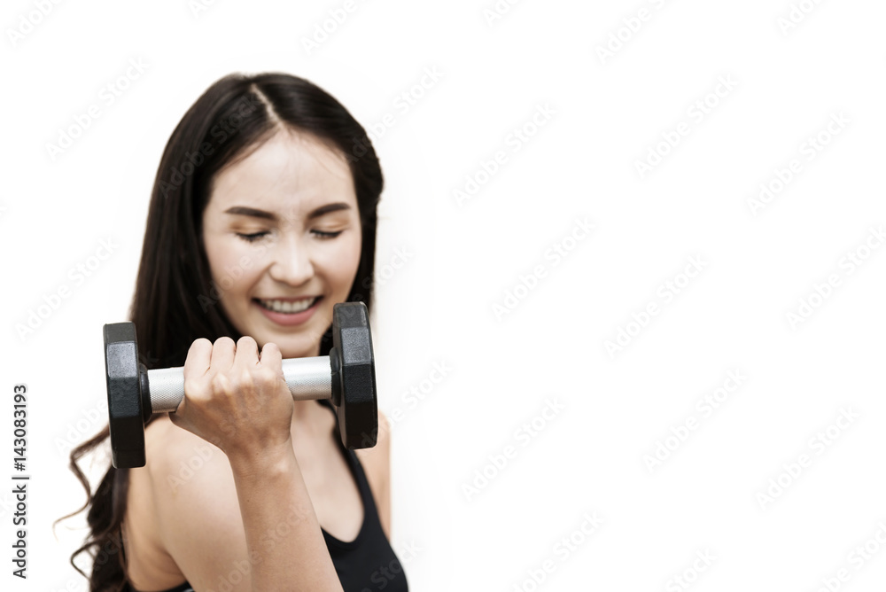 Woman lifting dumbbell in the gym. Isolated background. Happiness, smiling. Woman lifting dumbbell in the gym. Isolated background. Happiness, smiling.