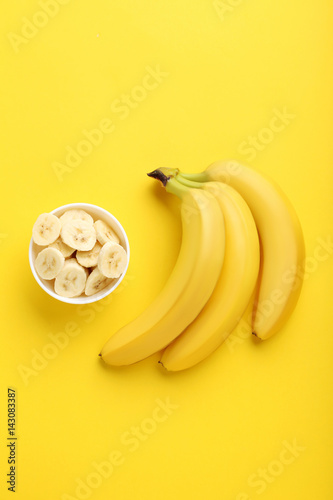 Sweet bananas on the yellow background
