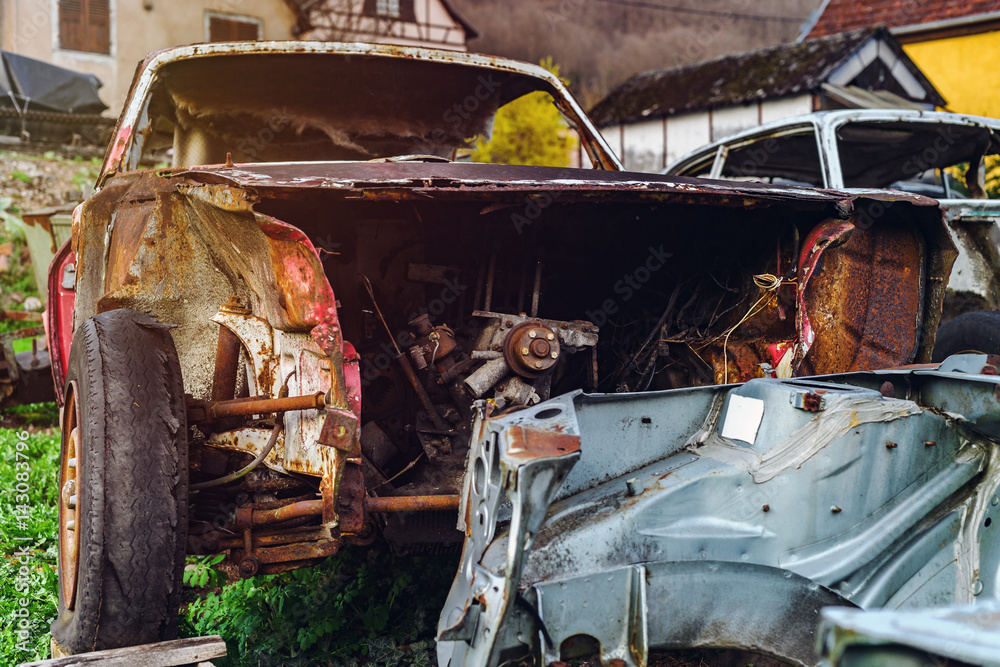 Abandoned old rusty body and parts of retro car Abandoned old rusty body and parts of retro car