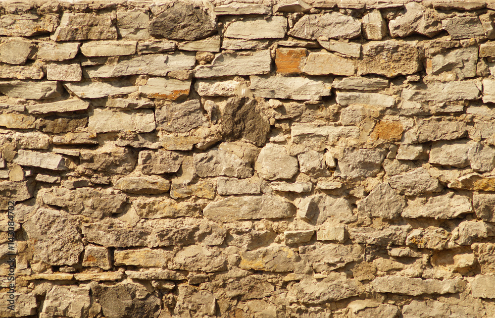 Grey stone wall background. Surface stone wall background.