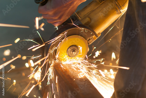 Man working with a power saw. Close-up .