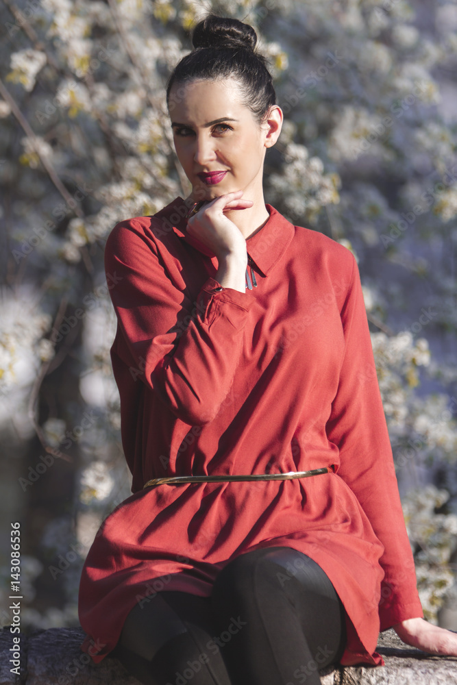 Young beautiful women dressed in fashionable clothes enjoying sunny weather in Spring time Young beautiful women dressed in fashionable clothes enjoying sunny weather in Spring time