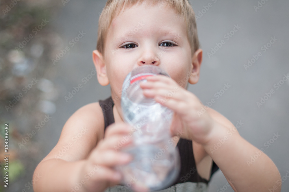 Little boy drink water from bottle Little boy drink water from bottle