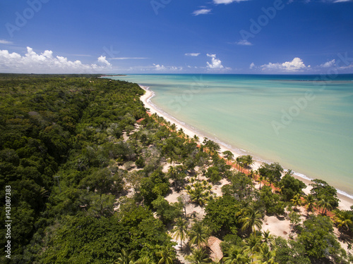 Aerial view Green sea at a brazilian beach coast on a sunny day in Cumuruxatiba, Bahia, Brazil. february, 2017.