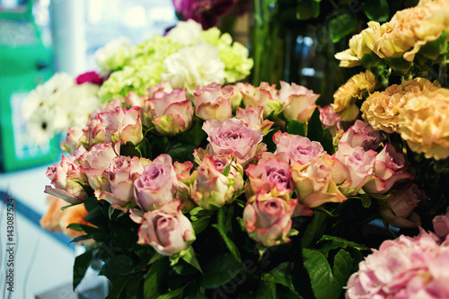 Colorful roses and other flowers at the entry to flower shop Bouquet decorate in front of flower shop Many flowers in the market flowers at farmers  market