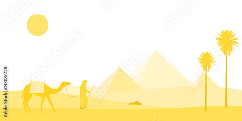 Egypt. A bedouin and his camel in a yellow desert landscape with pyramids in the background