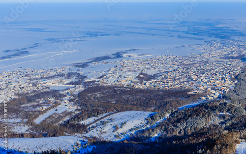 View from Tserkovka mountain to the resort town of Belokurikha in winter, Altai, Russia photo