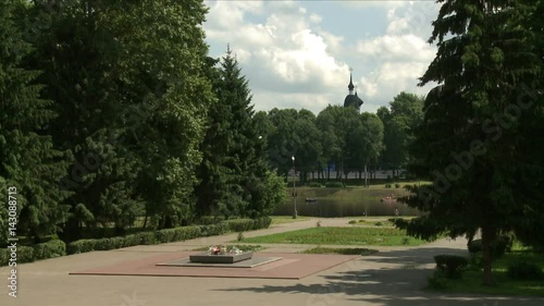War monument and lake in summer city park view photo