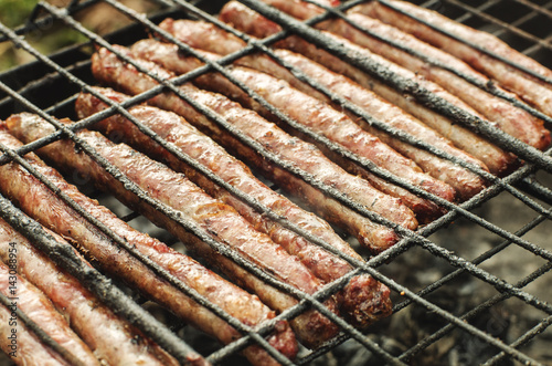 Close up grilled pork sausages on bbq