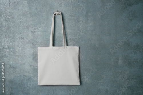 White textile bag on grey background