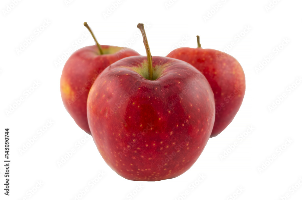Three red apples. Red apples isolated on white background. One apple in the foreground. Three red apples. Red apples isolated on white background. One apple in the foreground.