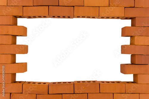 A hole in a brick wall. Brick wall with a hole on a white background.