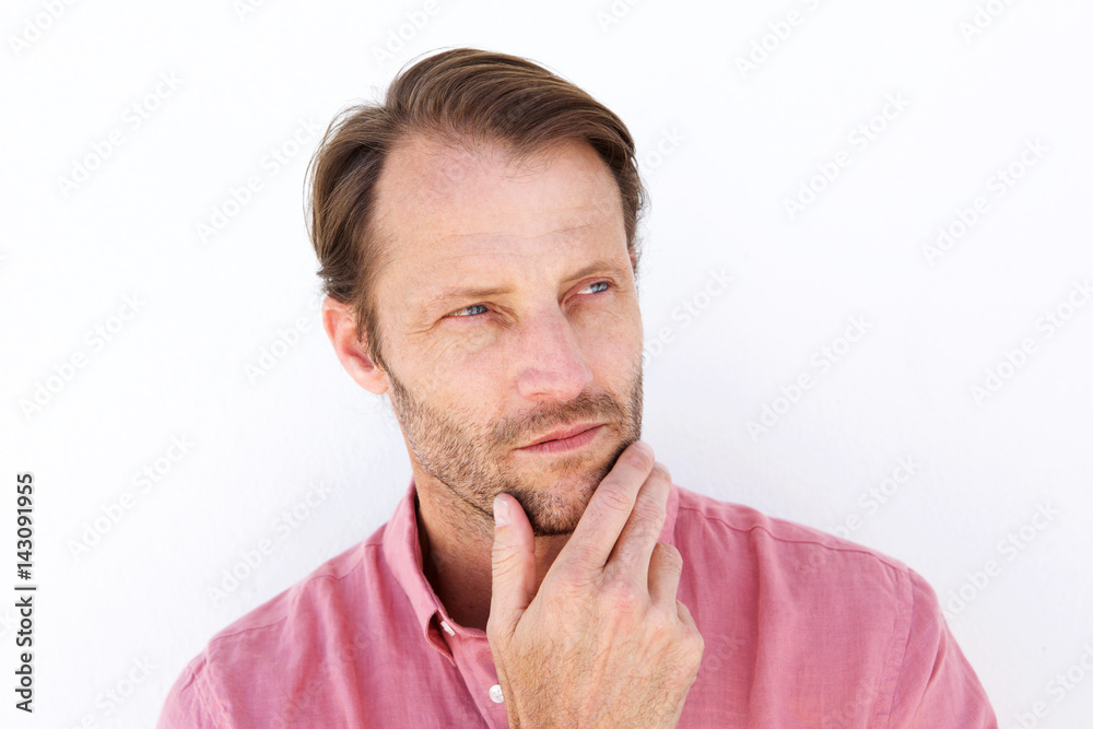 serious man with hand to chin serious man with hand to chin
