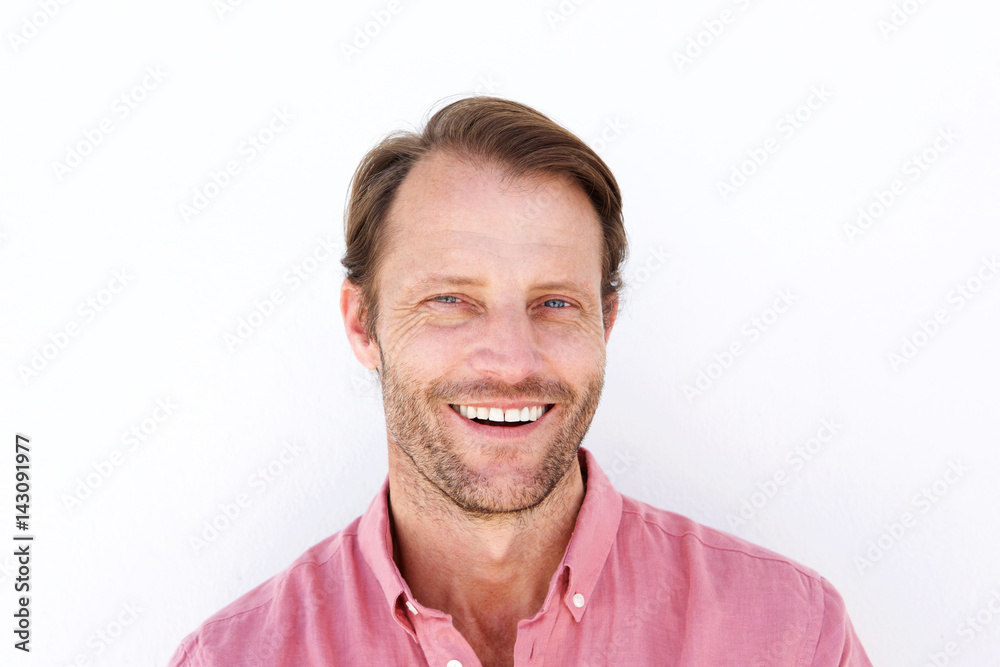 Close up attractive man smiling against white background Close up attractive man smiling against white background