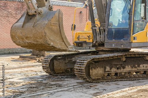 Close up backhoe standing at construction site