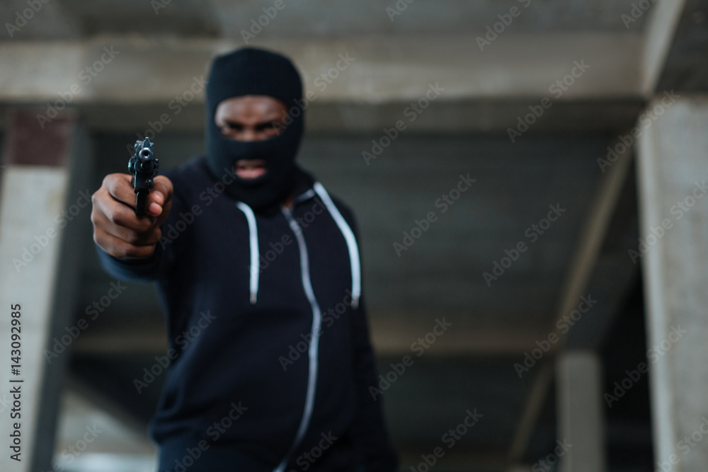 Handgun being used by a criminal Handgun being used by a criminal