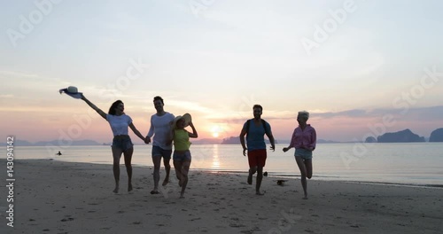Young People Group On Beach At Sunset, Friends Walking Seaside, Tourists Sea Vacation Slow Motion 60