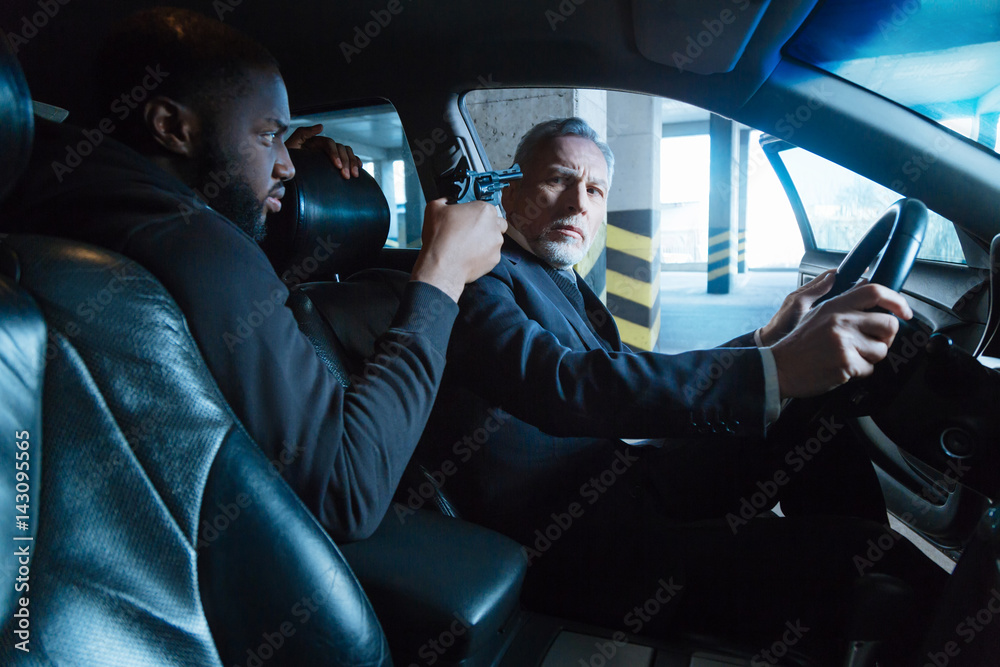 Unhappy stressed man sitting behind the wheel Unhappy stressed man sitting behind the wheel