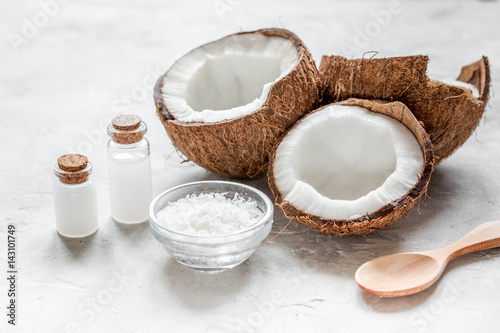 cosmetic concept with fresh coconuts on white table background