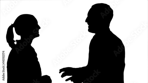Silhouette Handsome man and attractive young woman talking and smiling.